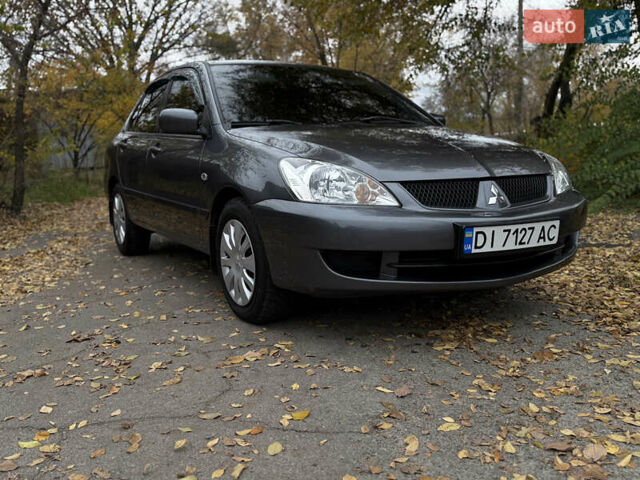 Сірий Міцубісі Lancer, об'ємом двигуна 1.58 л та пробігом 247 тис. км за 4900 $, фото 1 на Automoto.ua