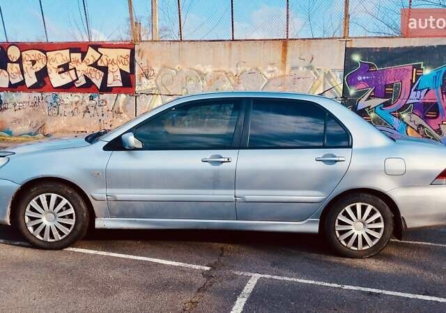 Серый Мицубиси Лансер, объемом двигателя 1.6 л и пробегом 205 тыс. км за 4500 $, фото 1 на Automoto.ua
