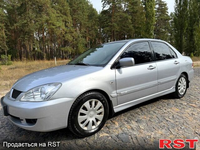 Серый Мицубиси Лансер, объемом двигателя 1.6 л и пробегом 200 тыс. км за 4400 $, фото 1 на Automoto.ua