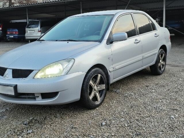 Серый Мицубиси Лансер, объемом двигателя 1.6 л и пробегом 199 тыс. км за 5000 $, фото 1 на Automoto.ua