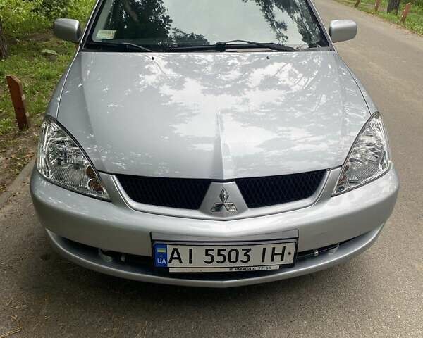 Серый Мицубиси Лансер, объемом двигателя 1.59 л и пробегом 220 тыс. км за 6500 $, фото 1 на Automoto.ua