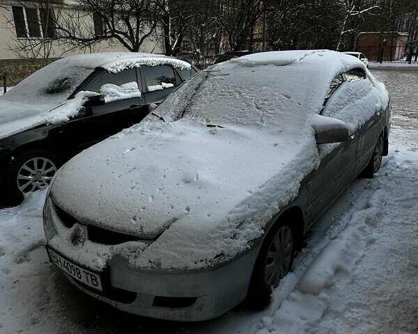 Серый Мицубиси Лансер, объемом двигателя 1.58 л и пробегом 185 тыс. км за 3300 $, фото 1 на Automoto.ua