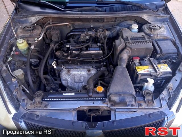 Серый Мицубиси Лансер, объемом двигателя 1.6 л и пробегом 225 тыс. км за 3200 $, фото 1 на Automoto.ua