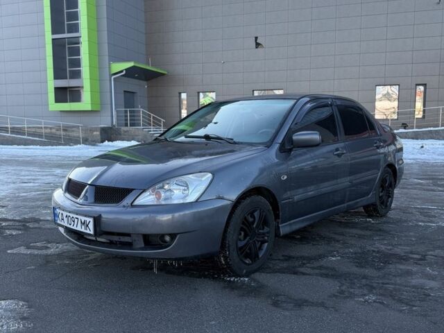 Серый Мицубиси Лансер, объемом двигателя 1.6 л и пробегом 160 тыс. км за 3700 $, фото 1 на Automoto.ua