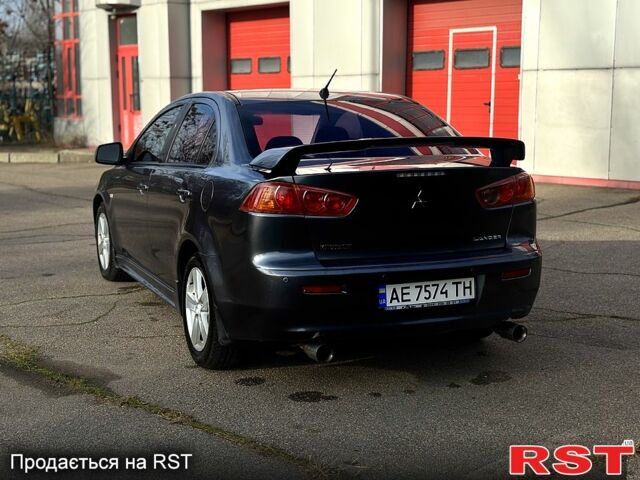 Серый Мицубиси Лансер, объемом двигателя 2 л и пробегом 22000 тыс. км за 6600 $, фото 1 на Automoto.ua