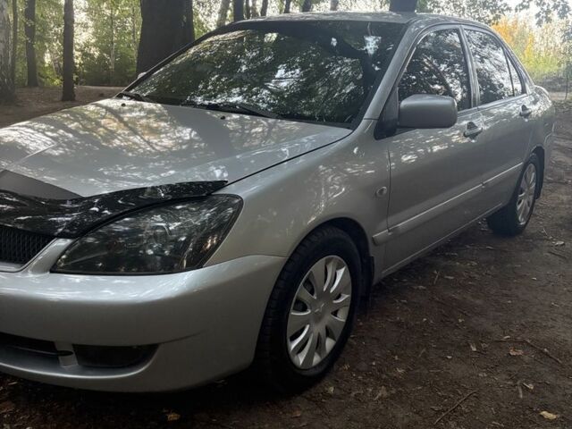 Сірий Міцубісі Lancer, об'ємом двигуна 1.6 л та пробігом 251 тис. км за 4292 $, фото 1 на Automoto.ua