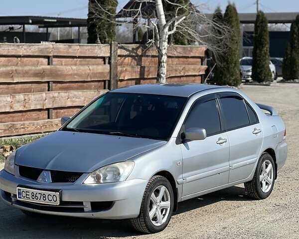 Сірий Міцубісі Lancer, об'ємом двигуна 1.6 л та пробігом 163 тис. км за 5000 $, фото 1 на Automoto.ua