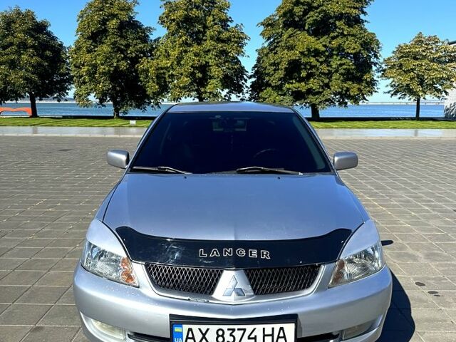 Серый Мицубиси Лансер, объемом двигателя 1.6 л и пробегом 250 тыс. км за 3700 $, фото 1 на Automoto.ua