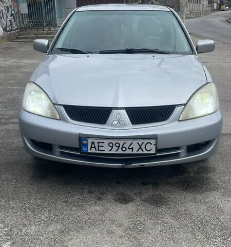 Серый Мицубиси Лансер, объемом двигателя 2 л и пробегом 230 тыс. км за 4000 $, фото 1 на Automoto.ua