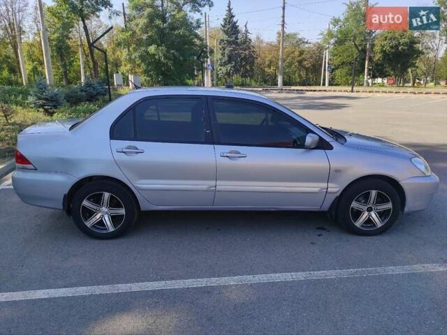 Серый Мицубиси Лансер, объемом двигателя 1.6 л и пробегом 187 тыс. км за 4500 $, фото 1 на Automoto.ua