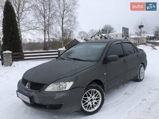 Серый Мицубиси Лансер, объемом двигателя 1.6 л и пробегом 320 тыс. км за 3999 $, фото 1 на Automoto.ua