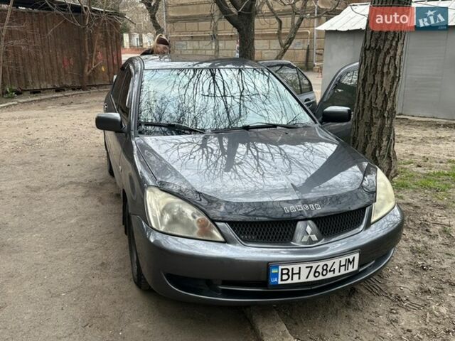 Серый Мицубиси Лансер, объемом двигателя 1.6 л и пробегом 203 тыс. км за 4200 $, фото 1 на Automoto.ua
