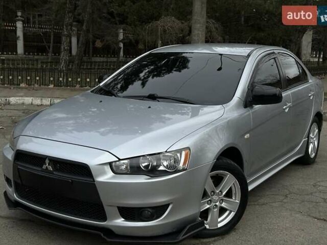 Серый Мицубиси Лансер, объемом двигателя 2 л и пробегом 199 тыс. км за 6999 $, фото 1 на Automoto.ua