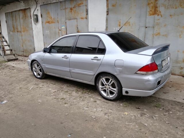 Серый Мицубиси Лансер, объемом двигателя 2 л и пробегом 495 тыс. км за 2800 $, фото 1 на Automoto.ua