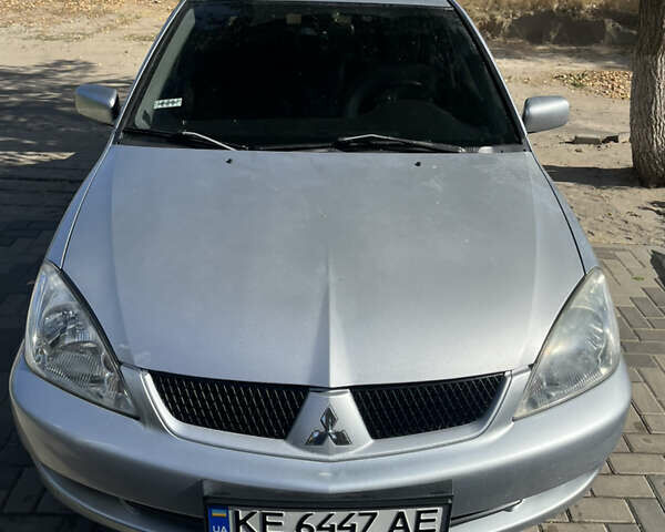 Сірий Міцубісі Lancer, об'ємом двигуна 1.58 л та пробігом 212 тис. км за 5600 $, фото 1 на Automoto.ua