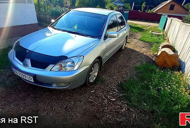 Серый Мицубиси Лансер, объемом двигателя 1.6 л и пробегом 282 тыс. км за 3850 $, фото 1 на Automoto.ua