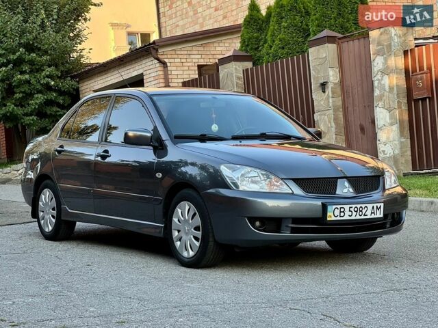 Сірий Міцубісі Lancer, об'ємом двигуна 1.6 л та пробігом 240 тис. км за 4950 $, фото 1 на Automoto.ua