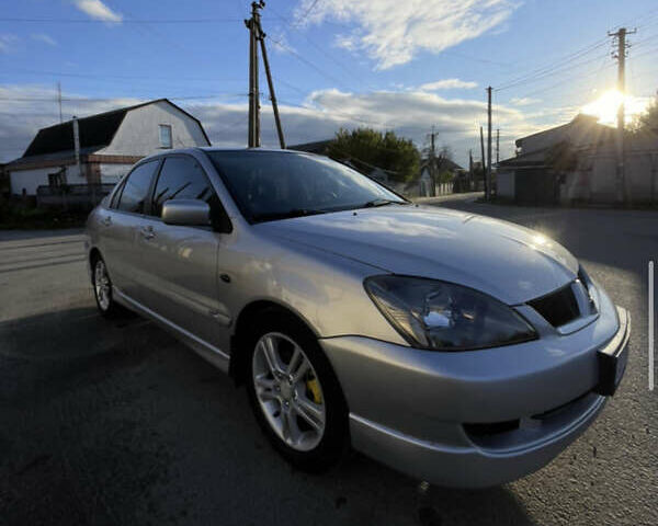 Серый Мицубиси Лансер, объемом двигателя 2 л и пробегом 182 тыс. км за 4999 $, фото 1 на Automoto.ua