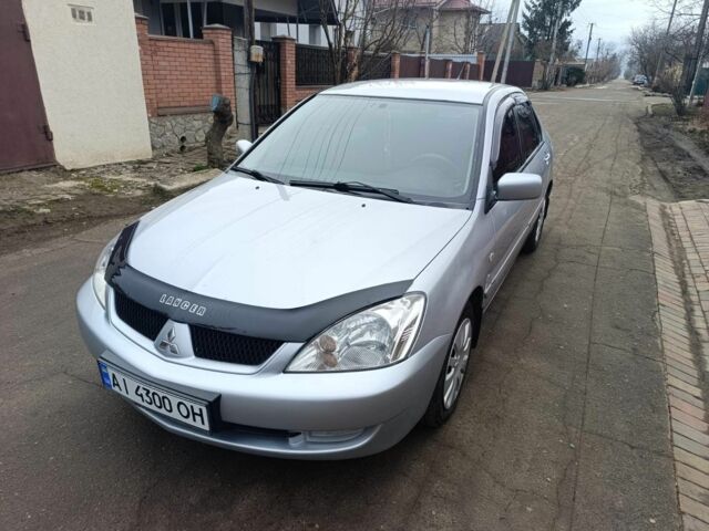 Сірий Міцубісі Lancer, об'ємом двигуна 1.8 л та пробігом 107 тис. км за 4300 $, фото 1 на Automoto.ua