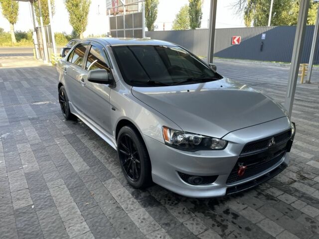 Серый Мицубиси Лансер, объемом двигателя 2 л и пробегом 244 тыс. км за 6500 $, фото 1 на Automoto.ua