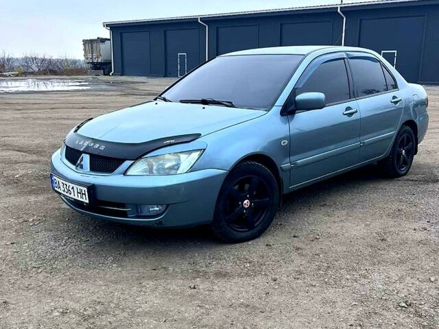 Серый Мицубиси Лансер, объемом двигателя 1.6 л и пробегом 341 тыс. км за 3500 $, фото 1 на Automoto.ua