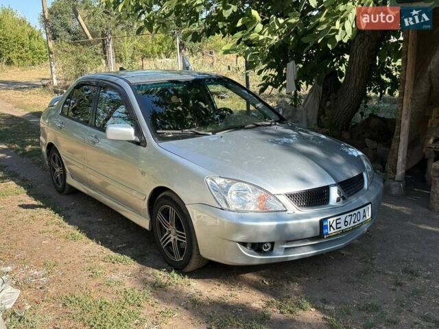 Серый Мицубиси Лансер, объемом двигателя 1.58 л и пробегом 260 тыс. км за 4000 $, фото 1 на Automoto.ua