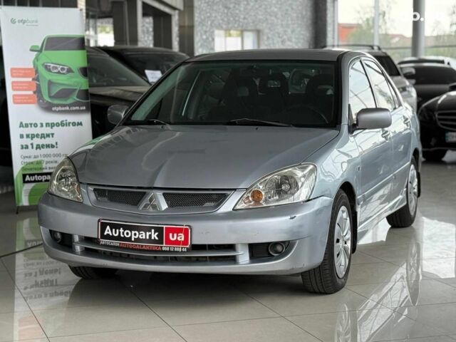 Серый Мицубиси Лансер, объемом двигателя 1.6 л и пробегом 174 тыс. км за 5990 $, фото 1 на Automoto.ua