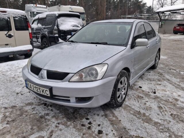 Сірий Міцубісі Lancer, об'ємом двигуна 1.6 л та пробігом 245 тис. км за 3999 $, фото 1 на Automoto.ua