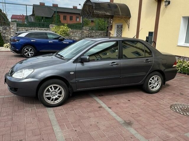 Сірий Міцубісі Lancer, об'ємом двигуна 1.6 л та пробігом 192 тис. км за 4500 $, фото 1 на Automoto.ua