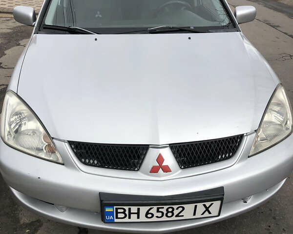 Серый Мицубиси Лансер, объемом двигателя 1.6 л и пробегом 450 тыс. км за 4500 $, фото 1 на Automoto.ua