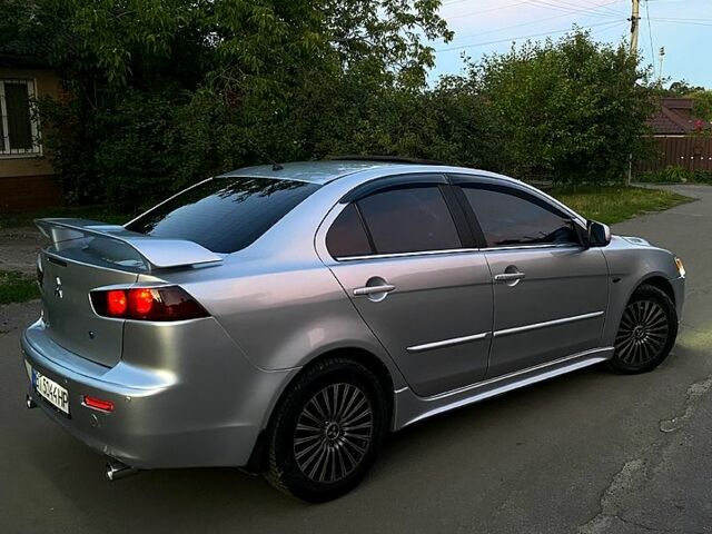 Серый Мицубиси Лансер, объемом двигателя 2 л и пробегом 220 тыс. км за 6500 $, фото 1 на Automoto.ua