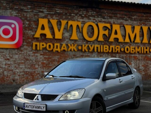 Серый Мицубиси Лансер, объемом двигателя 1.58 л и пробегом 262 тыс. км за 4499 $, фото 1 на Automoto.ua