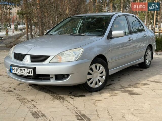 Сірий Міцубісі Lancer, об'ємом двигуна 1.58 л та пробігом 183 тис. км за 4200 $, фото 1 на Automoto.ua