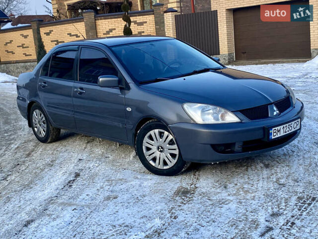 Сірий Міцубісі Lancer, об'ємом двигуна 1.6 л та пробігом 239 тис. км за 4500 $, фото 1 на Automoto.ua