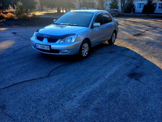 Серый Мицубиси Лансер, объемом двигателя 1.8 л и пробегом 106 тыс. км за 4500 $, фото 1 на Automoto.ua