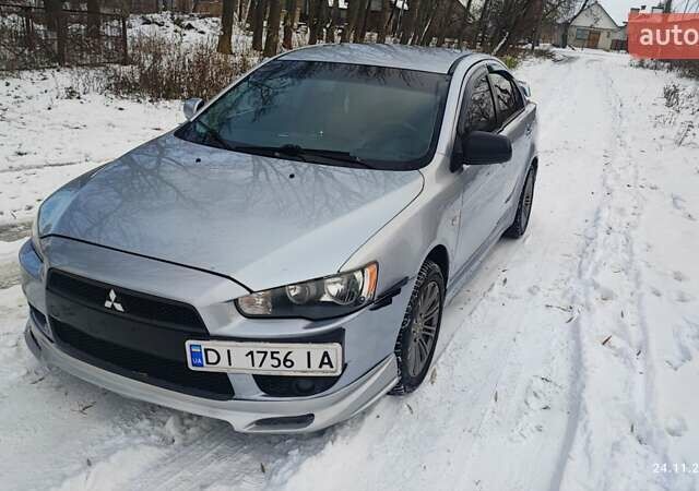 Серый Мицубиси Лансер, объемом двигателя 1.5 л и пробегом 292 тыс. км за 5000 $, фото 1 на Automoto.ua