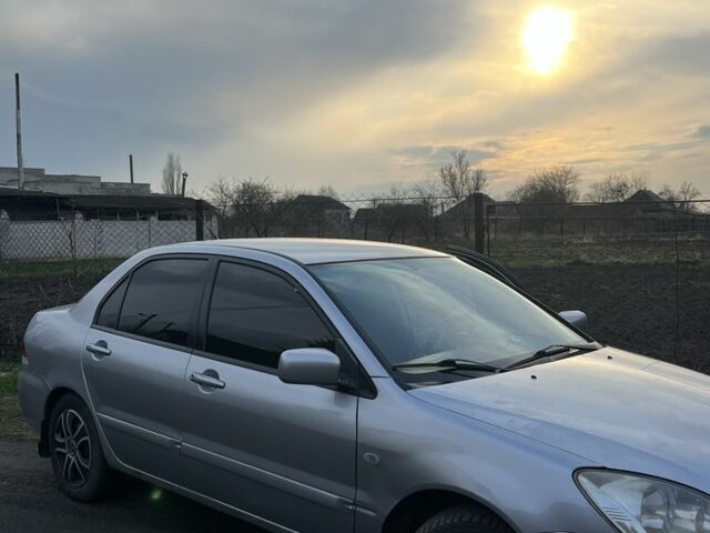 Сірий Міцубісі Lancer, об'ємом двигуна 1.6 л та пробігом 248 тис. км за 3000 $, фото 1 на Automoto.ua