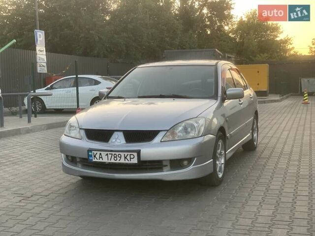 Сірий Міцубісі Lancer, об'ємом двигуна 1.58 л та пробігом 316 тис. км за 3450 $, фото 1 на Automoto.ua