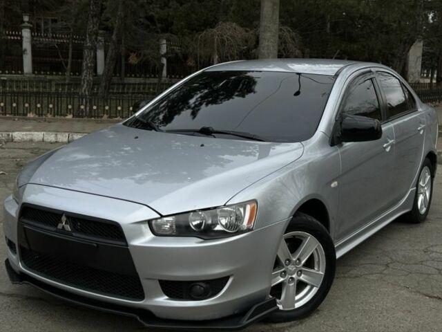 Серый Мицубиси Лансер, объемом двигателя 2 л и пробегом 199 тыс. км за 7000 $, фото 1 на Automoto.ua