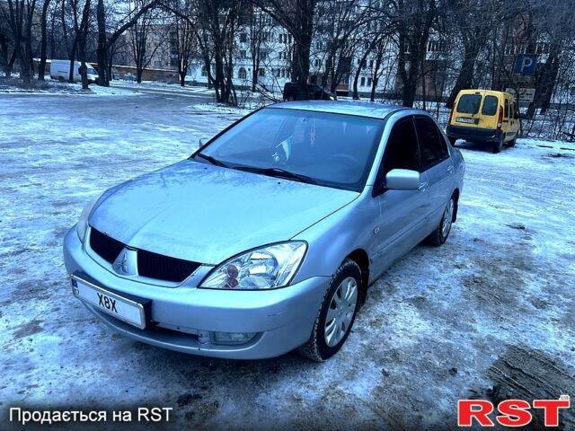 Серый Мицубиси Лансер, объемом двигателя 1.6 л и пробегом 23100 тыс. км за 3600 $, фото 1 на Automoto.ua
