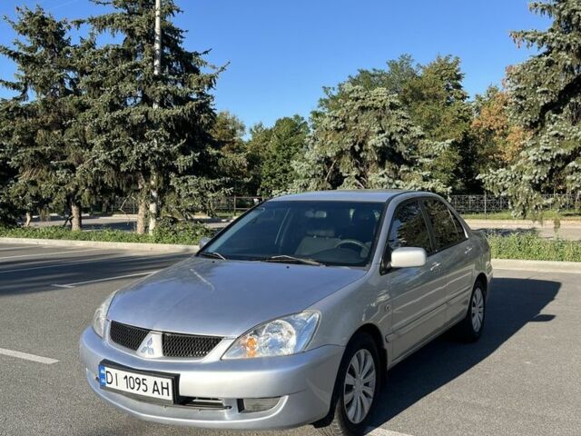 Сірий Міцубісі Lancer, об'ємом двигуна 1.6 л та пробігом 299 тис. км за 3953 $, фото 1 на Automoto.ua