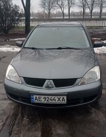 Сірий Міцубісі Lancer, об'ємом двигуна 1.58 л та пробігом 218 тис. км за 4700 $, фото 1 на Automoto.ua