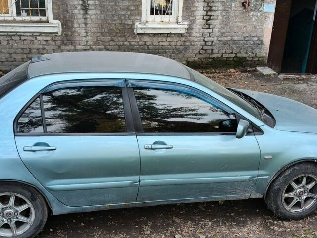 Сірий Міцубісі Lancer, об'ємом двигуна 1.6 л та пробігом 300 тис. км за 3700 $, фото 1 на Automoto.ua