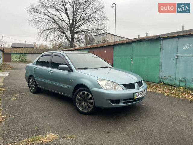 Серый Мицубиси Лансер, объемом двигателя 1.58 л и пробегом 205 тыс. км за 4750 $, фото 1 на Automoto.ua