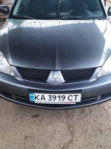 Серый Мицубиси Лансер, объемом двигателя 1.58 л и пробегом 400 тыс. км за 5000 $, фото 1 на Automoto.ua