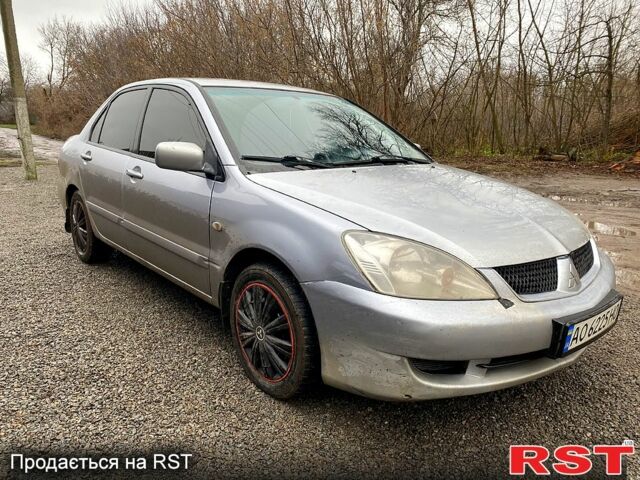 Серый Мицубиси Лансер, объемом двигателя 1.6 л и пробегом 224 тыс. км за 3200 $, фото 1 на Automoto.ua