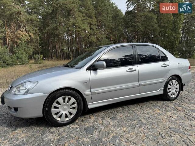 Серый Мицубиси Лансер, объемом двигателя 1.6 л и пробегом 200 тыс. км за 4400 $, фото 1 на Automoto.ua