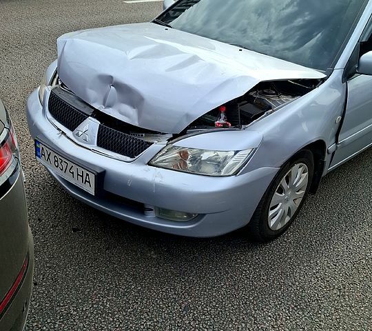 Серый Мицубиси Лансер, объемом двигателя 1.6 л и пробегом 260 тыс. км за 2700 $, фото 1 на Automoto.ua