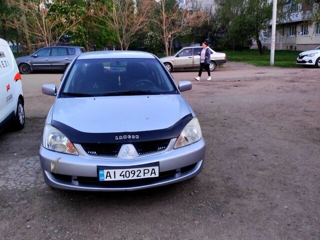 Серый Мицубиси Лансер, объемом двигателя 1.6 л и пробегом 302 тыс. км за 3200 $, фото 1 на Automoto.ua