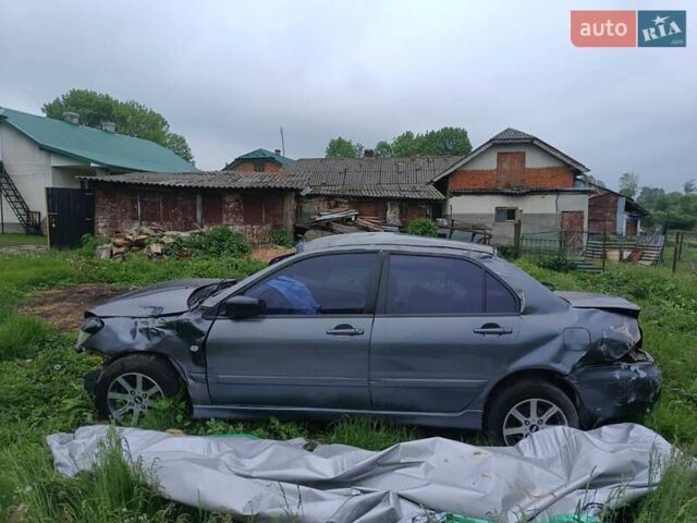 Сірий Міцубісі Lancer, об'ємом двигуна 1.59 л та пробігом 320 тис. км за 600 $, фото 1 на Automoto.ua